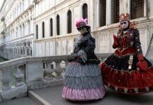 Traditional costumes and masks during Venice Carnival