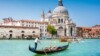 A traditional gondola close to the Basilica della Salute (c) Shutterstock.com